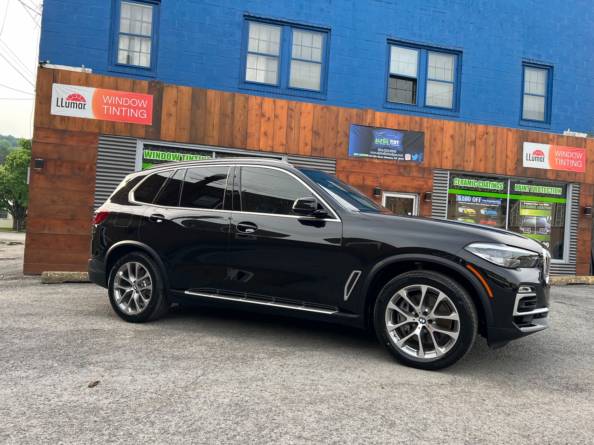 black suv at Alpha Tint & Detail Center